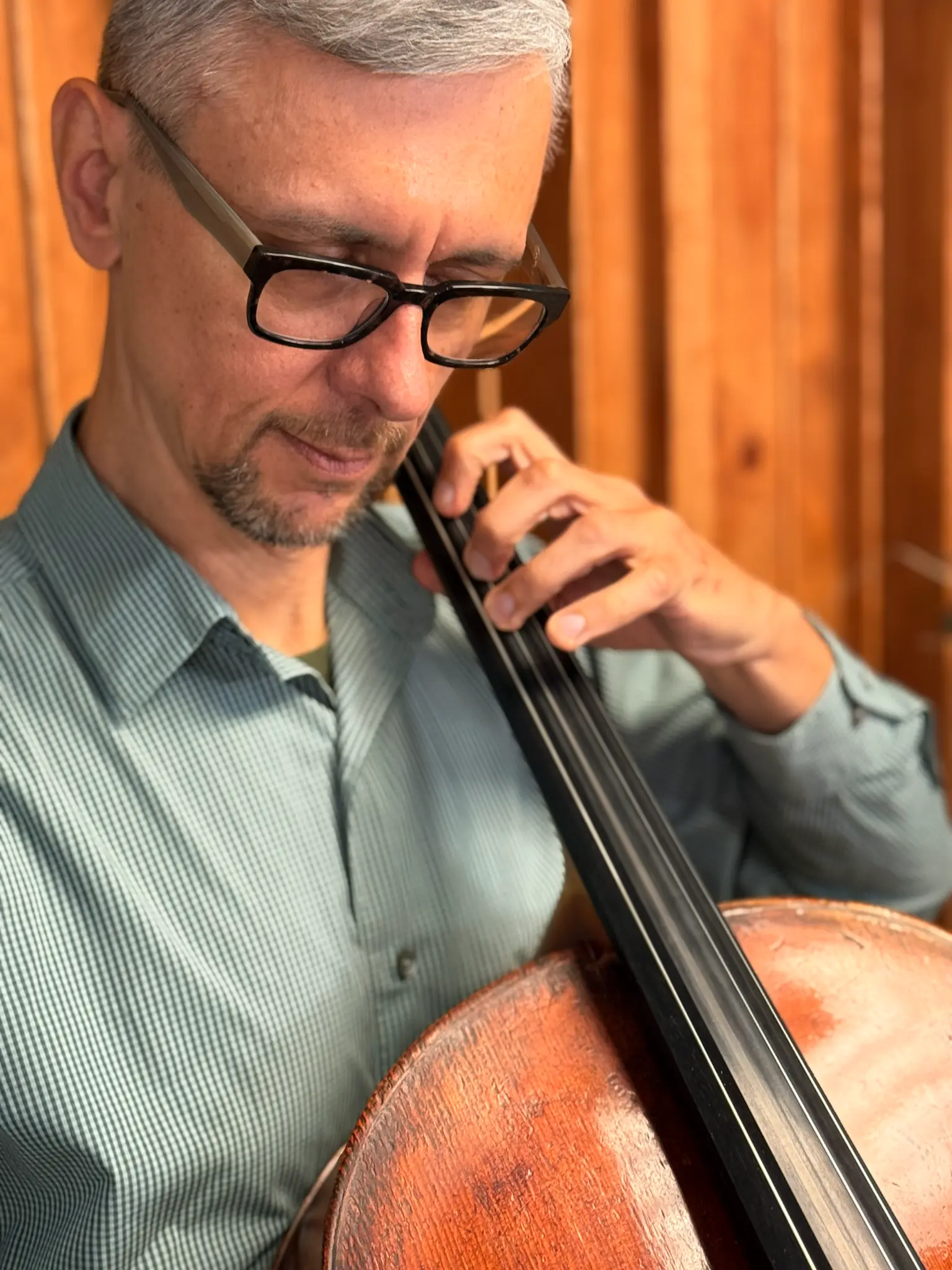 Dr. Maxim Kozlov teaching cello